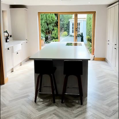 Contemporary kitchen with island and garden views